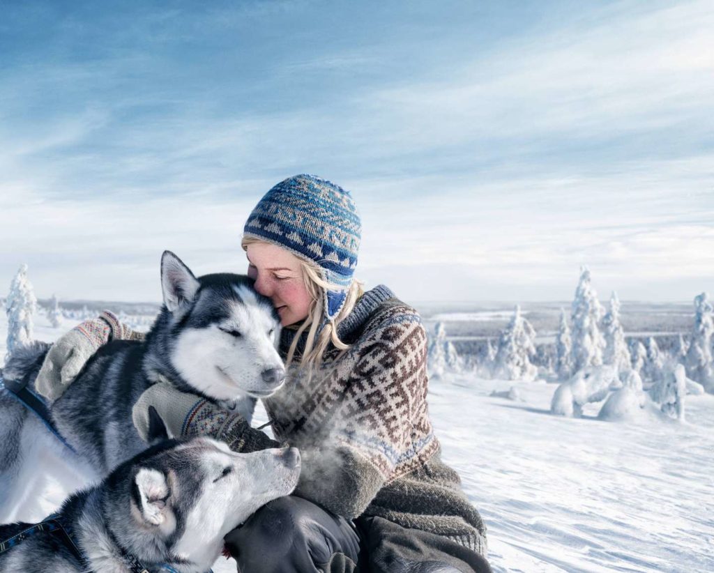 girl and a two huskies in winter