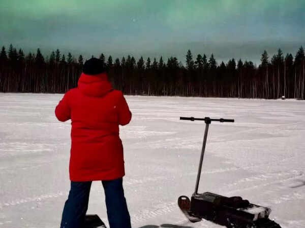 Aurora Hunting with Electric Snow Scooters